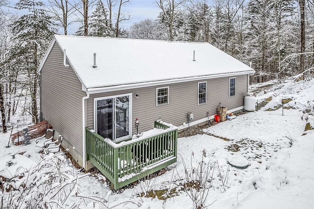 667 Brickyard Road Athol, MA 01331 - Photo 5 of 32 a view of house with yard and trees in the background