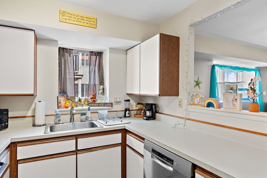 45 Main Street, Unit 21 Wareham, MA 02571 - Photo 14 of 29 a kitchen with a sink and a window