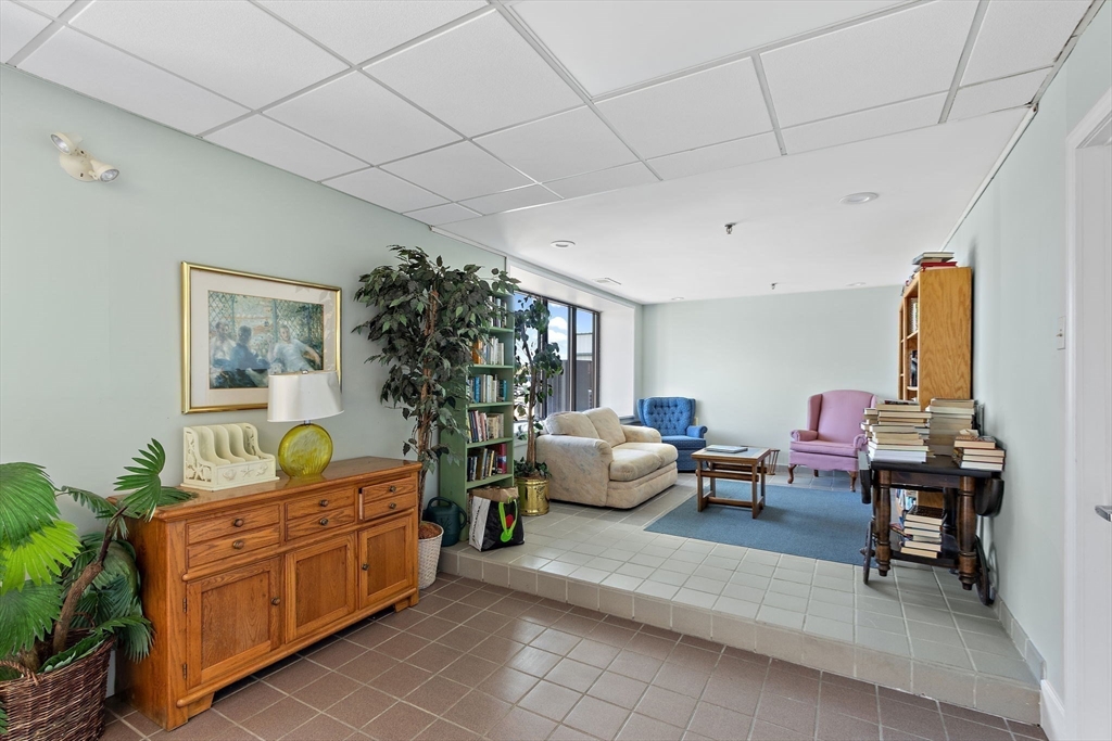 45 Main Street, Unit 21 Wareham, MA 02571 - Photo 22 of 29 a living room with furniture and a potted plant