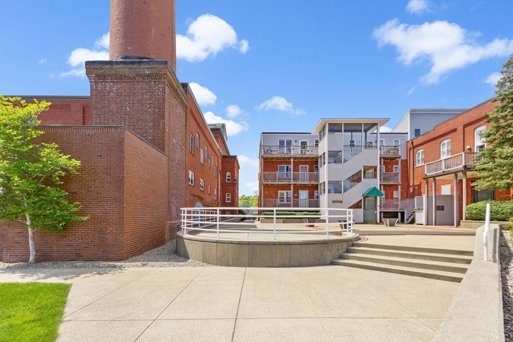 45 Main Street, Unit 21 Wareham, MA 02571 - Photo 24 of 29 a view of building with outdoor space