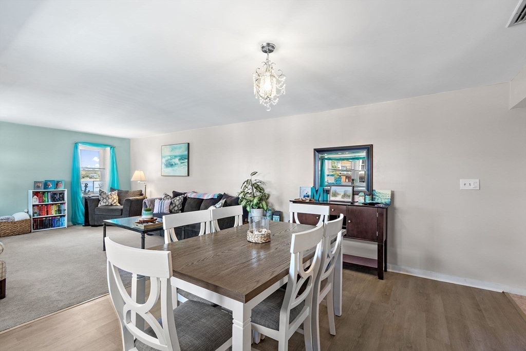 45 Main Street, Unit 21 Wareham, MA 02571 - Photo 10 of 29 a view of a dining room with furniture and wooden floor