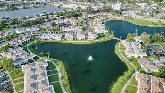 an aerial view of a residential houses with outdoor space