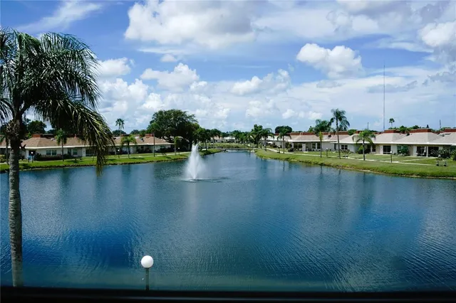 a view of a lake with houses in the background