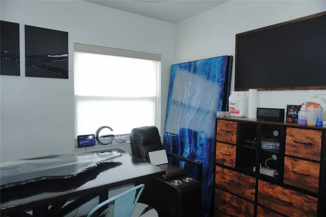 a view of a workspace with furniture