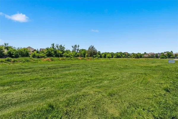 a view of lake with green space