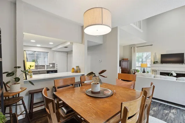 a kitchen with a dining table and chairs