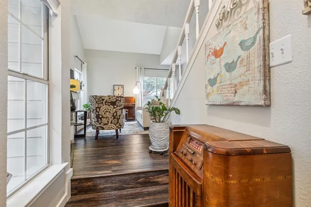 a view of an entryway with wooden floor