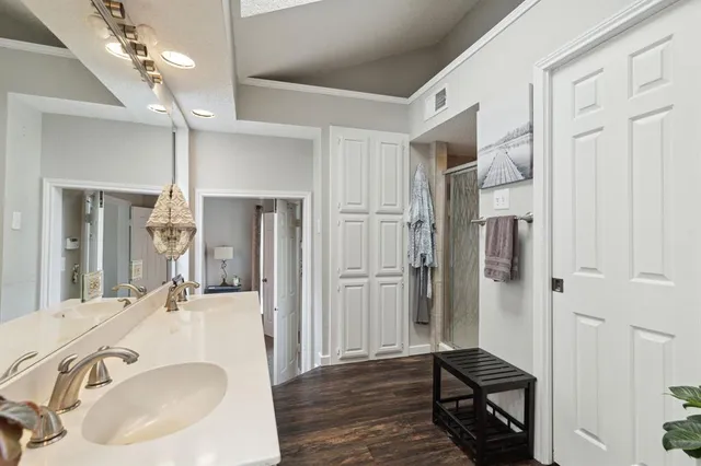 a bathroom with a sink tub and shower