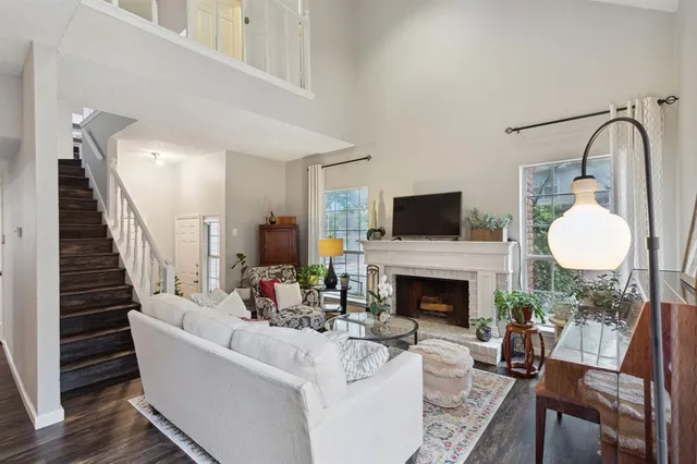 a living room with furniture a fireplace and a fireplace