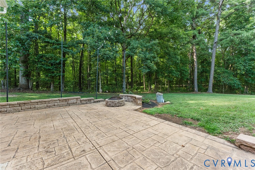 1496 Dorset Road Powhatan, VA 23139 - Photo 8 of 47 Expansive stamped concrete patio featuring a built