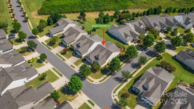 an aerial view of residential house with outdoor space and swimming pool