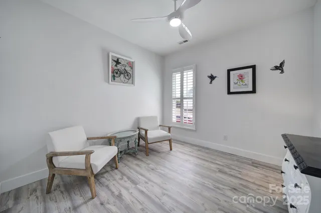 a living room with couch and a window