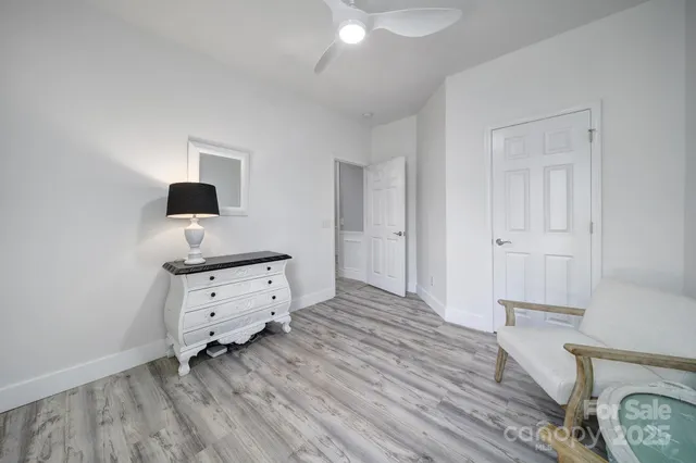 a room with chair and mirror