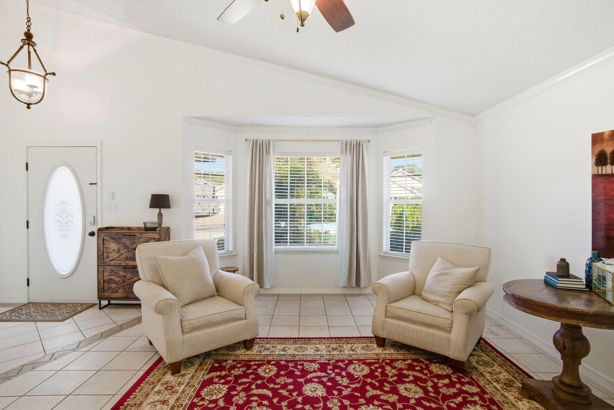 570 Rough Leaf Lane Mary Esther, FL 32569 - Photo 11 of 58 a living room with furniture and a large window