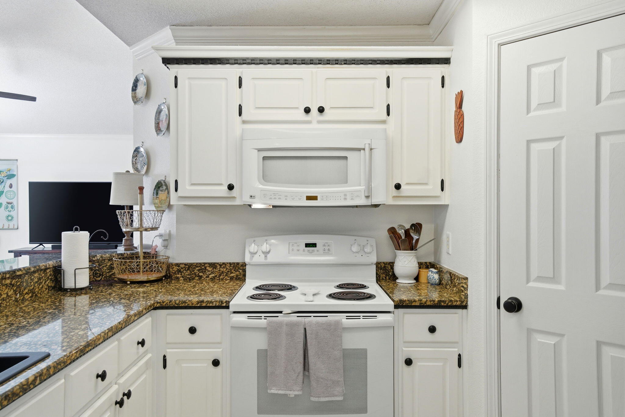570 Rough Leaf Lane Mary Esther, FL 32569 - Photo 18 of 58 a kitchen with granite countertop a stove and a sink
