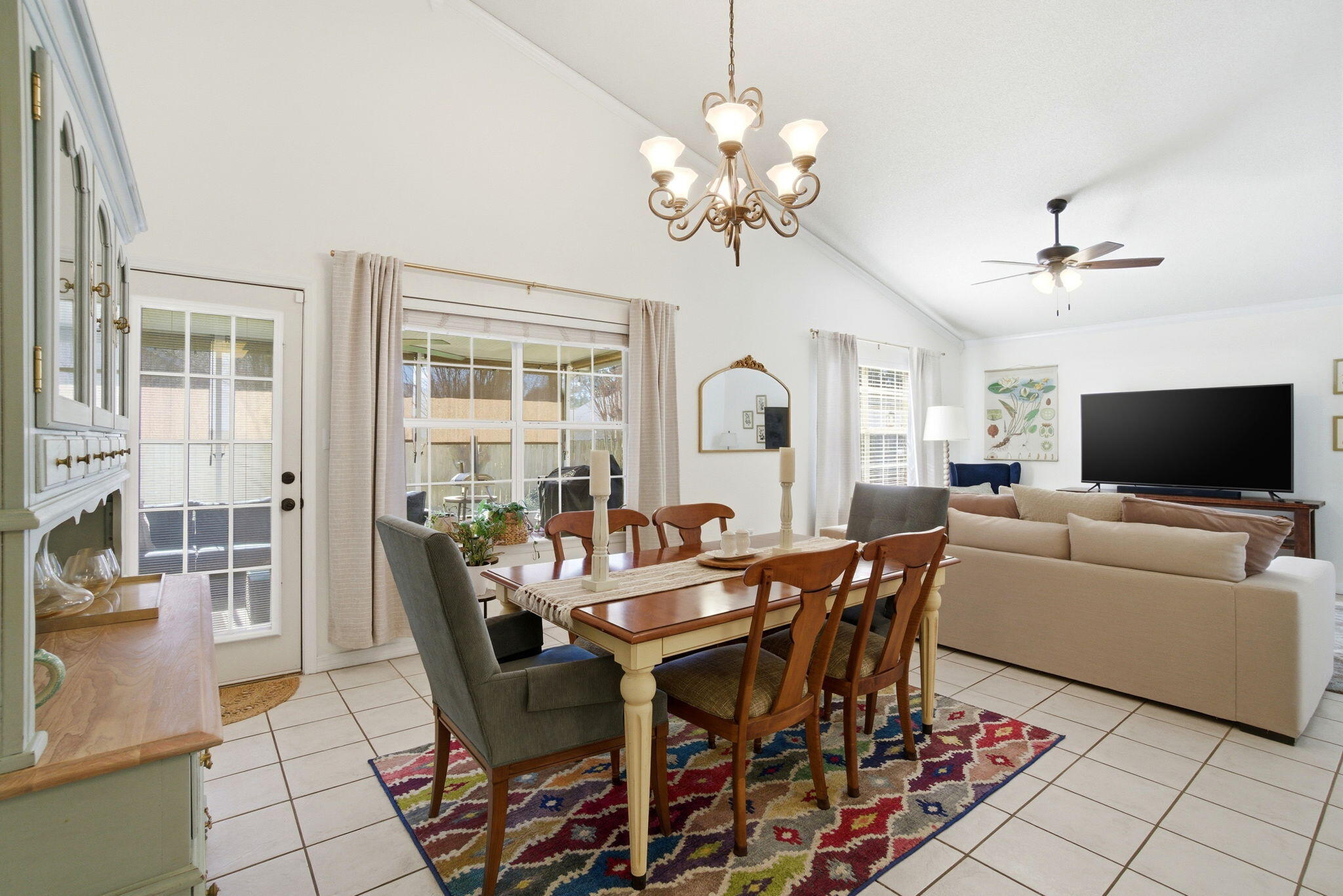 570 Rough Leaf Lane Mary Esther, FL 32569 - Photo 19 of 58 a view of a dining room with furniture and a chandelier