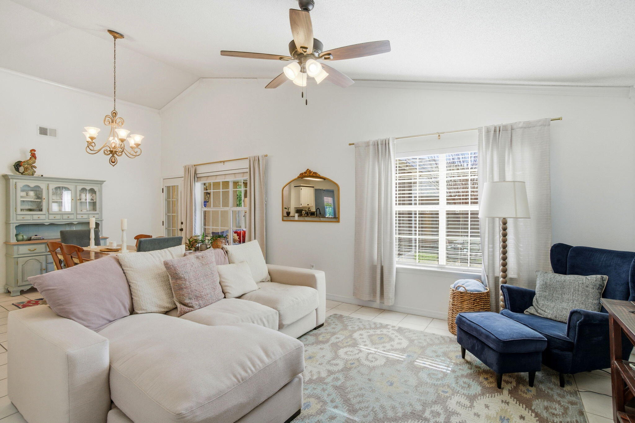 570 Rough Leaf Lane Mary Esther, FL 32569 - Photo 25 of 58 a living room with furniture chandelier and a window