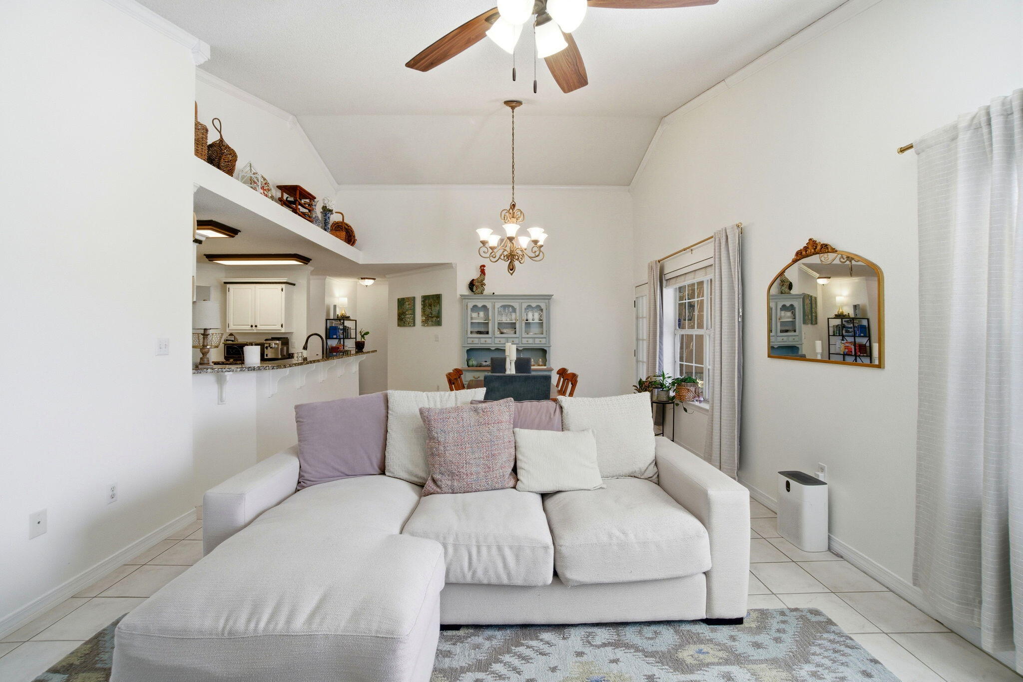 570 Rough Leaf Lane Mary Esther, FL 32569 - Photo 26 of 58 a living room with furniture and a chandelier