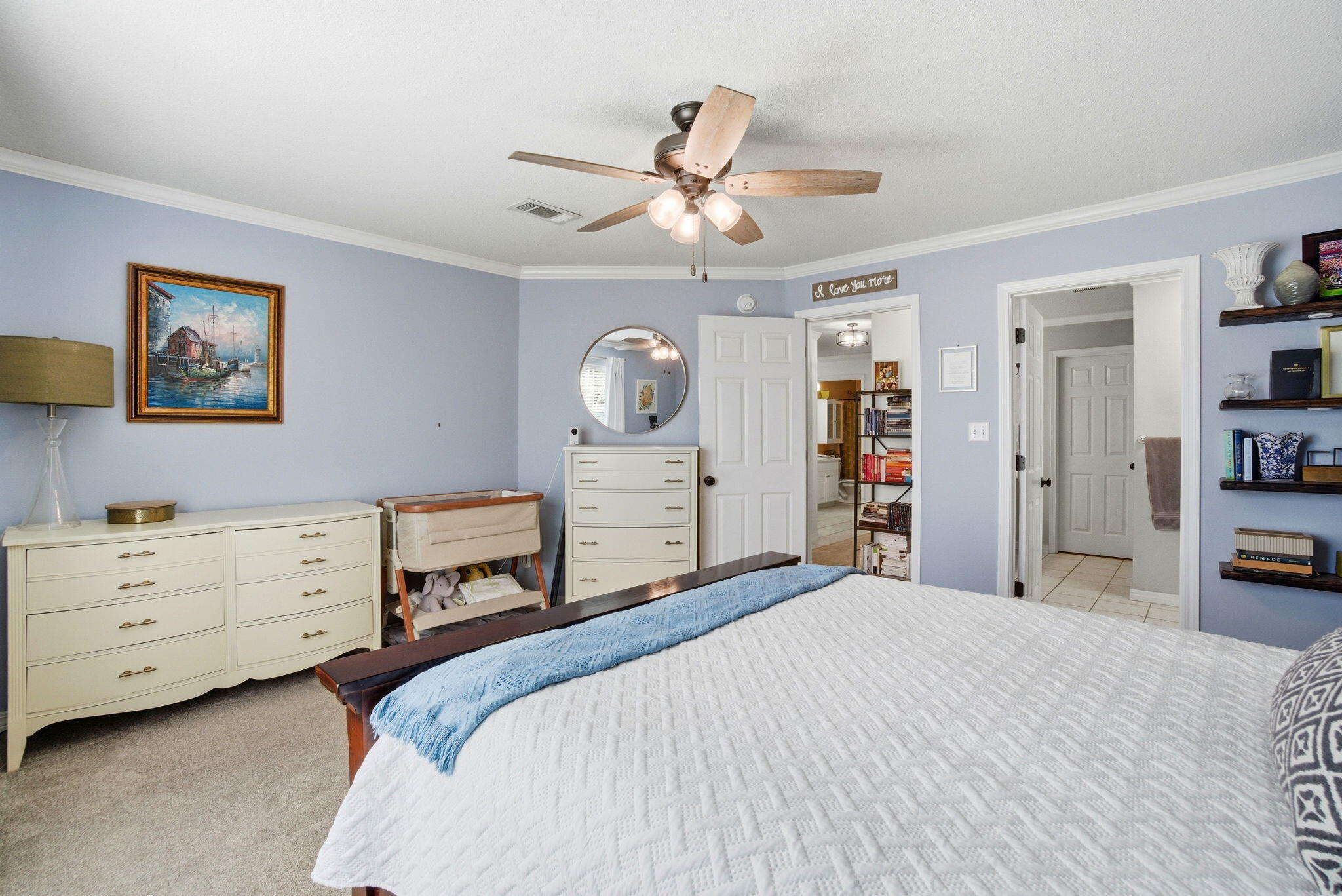 570 Rough Leaf Lane Mary Esther, FL 32569 - Photo 30 of 58 a bedroom with a bed and a chandelier