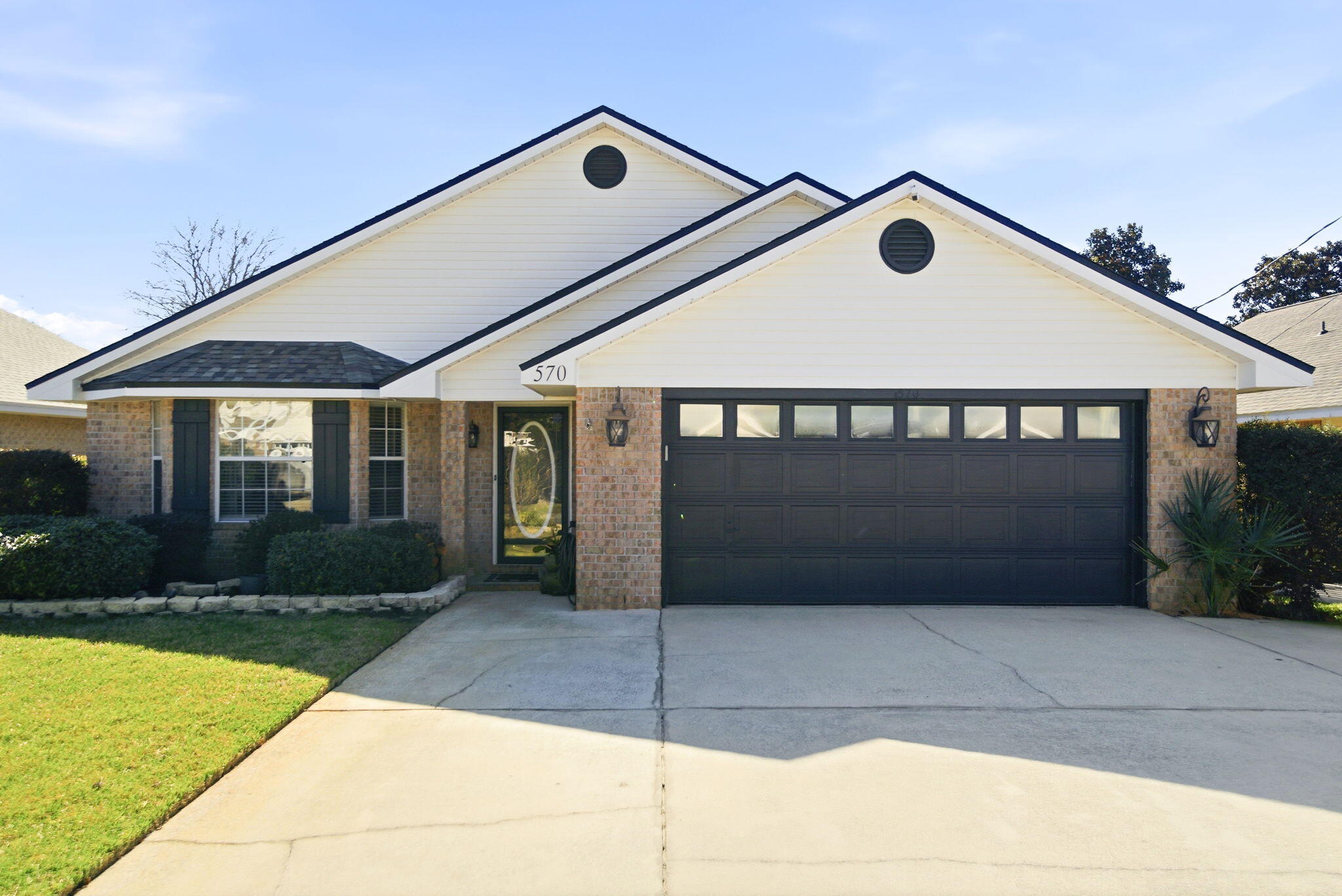 570 Rough Leaf Lane Mary Esther, FL 32569 - Photo 3 of 58 a front view of a house with garage