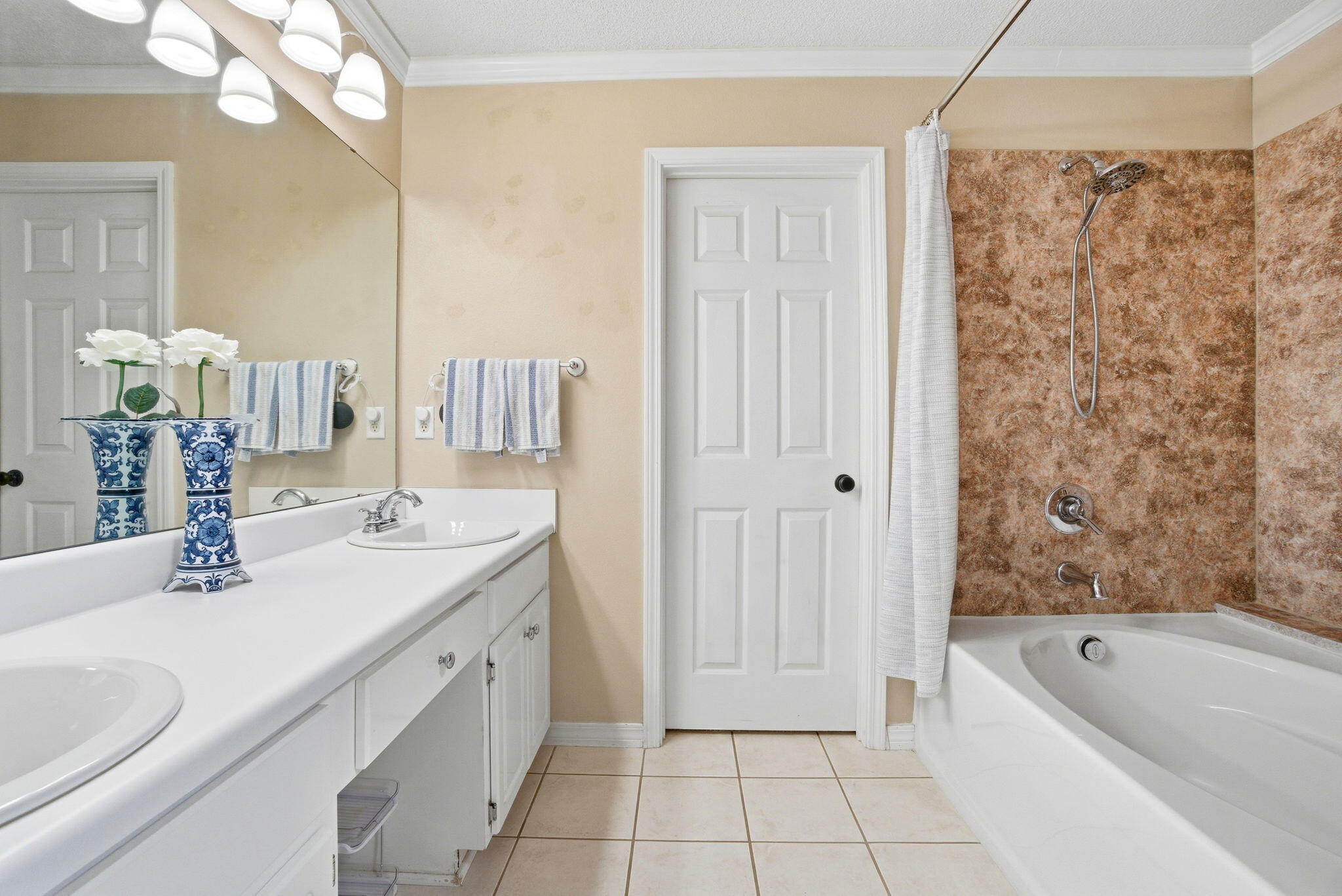 570 Rough Leaf Lane Mary Esther, FL 32569 - Photo 32 of 58 a bathroom with a granite countertop sink a toilet a mirror a bathtub and shower