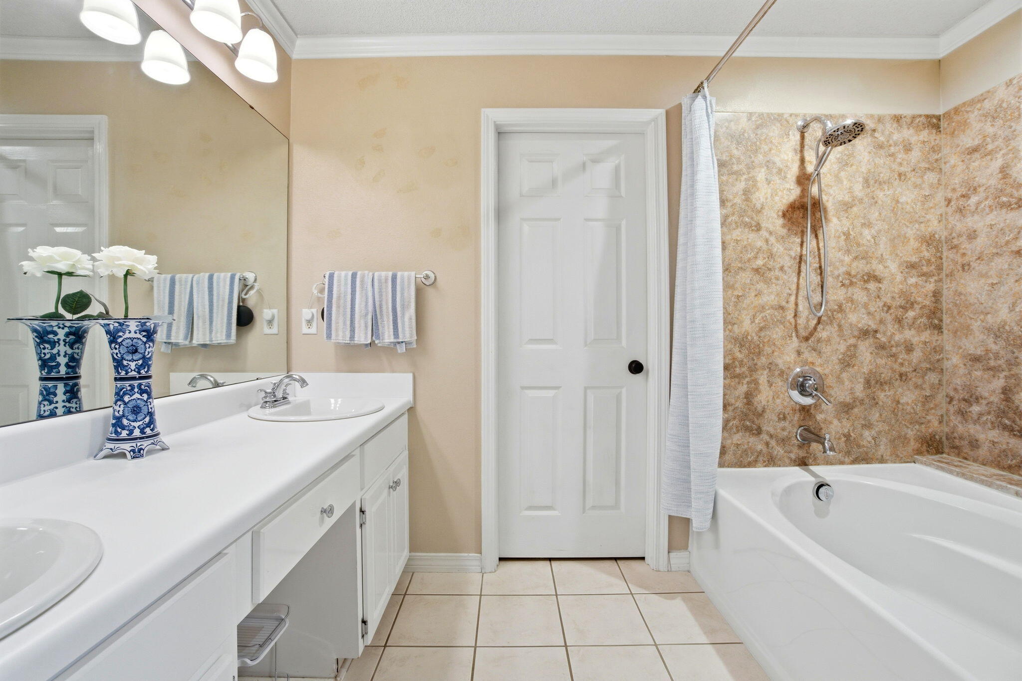 570 Rough Leaf Lane Mary Esther, FL 32569 - Photo 35 of 58 a bathroom with a granite countertop sink a toilet a mirror a shower and bathtub