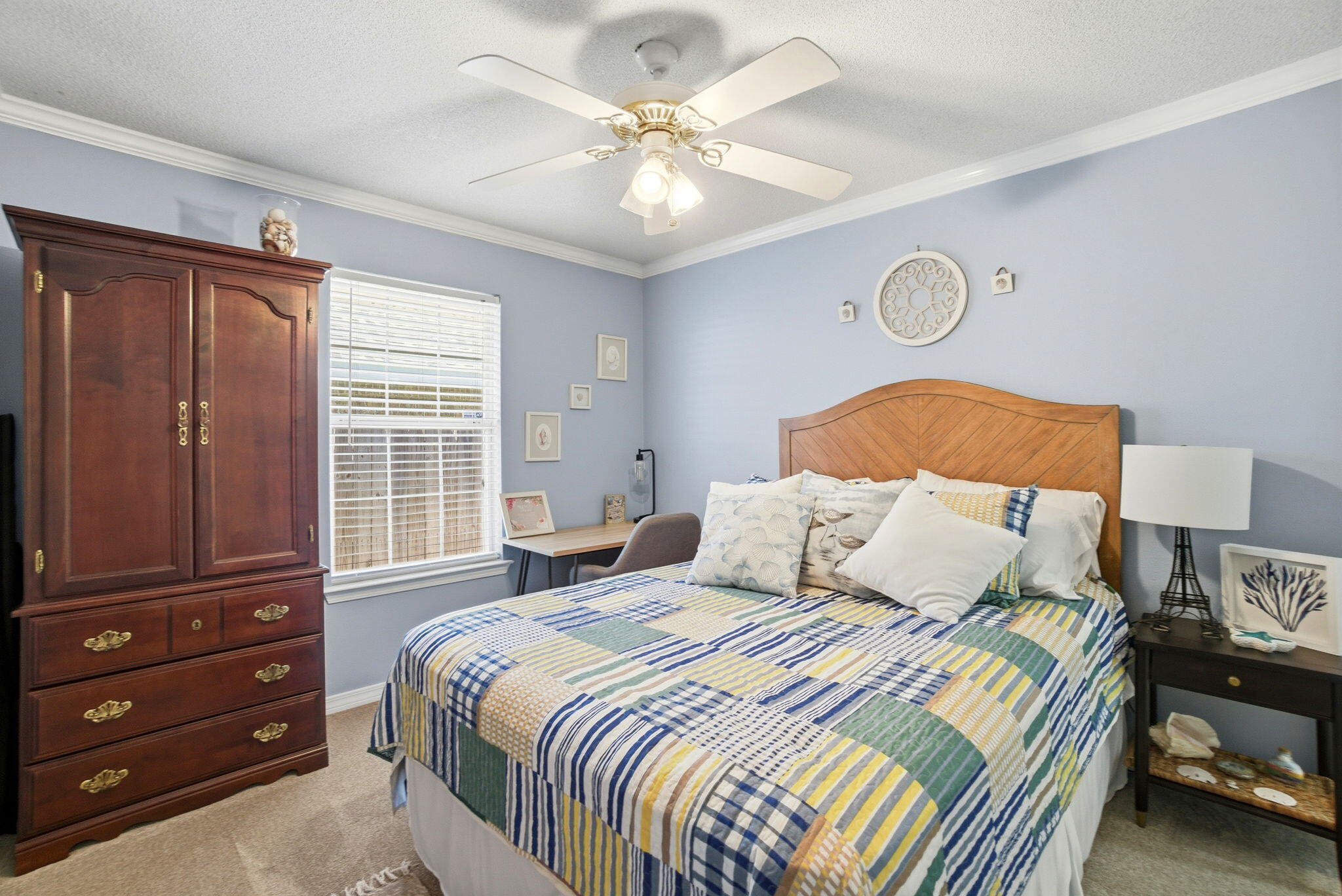 570 Rough Leaf Lane Mary Esther, FL 32569 - Photo 42 of 58 a bedroom with a bed and a chandelier