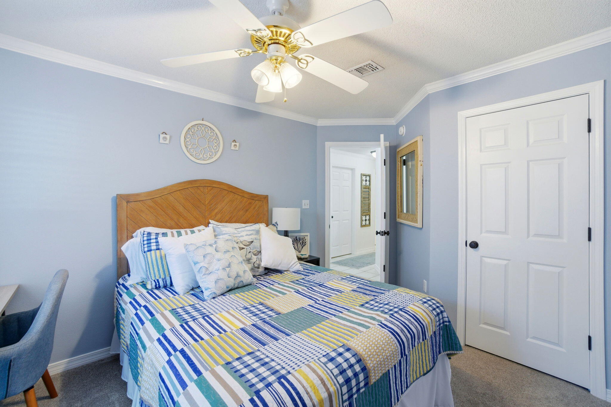 570 Rough Leaf Lane Mary Esther, FL 32569 - Photo 45 of 58 a bedroom with a bed and a chandelier