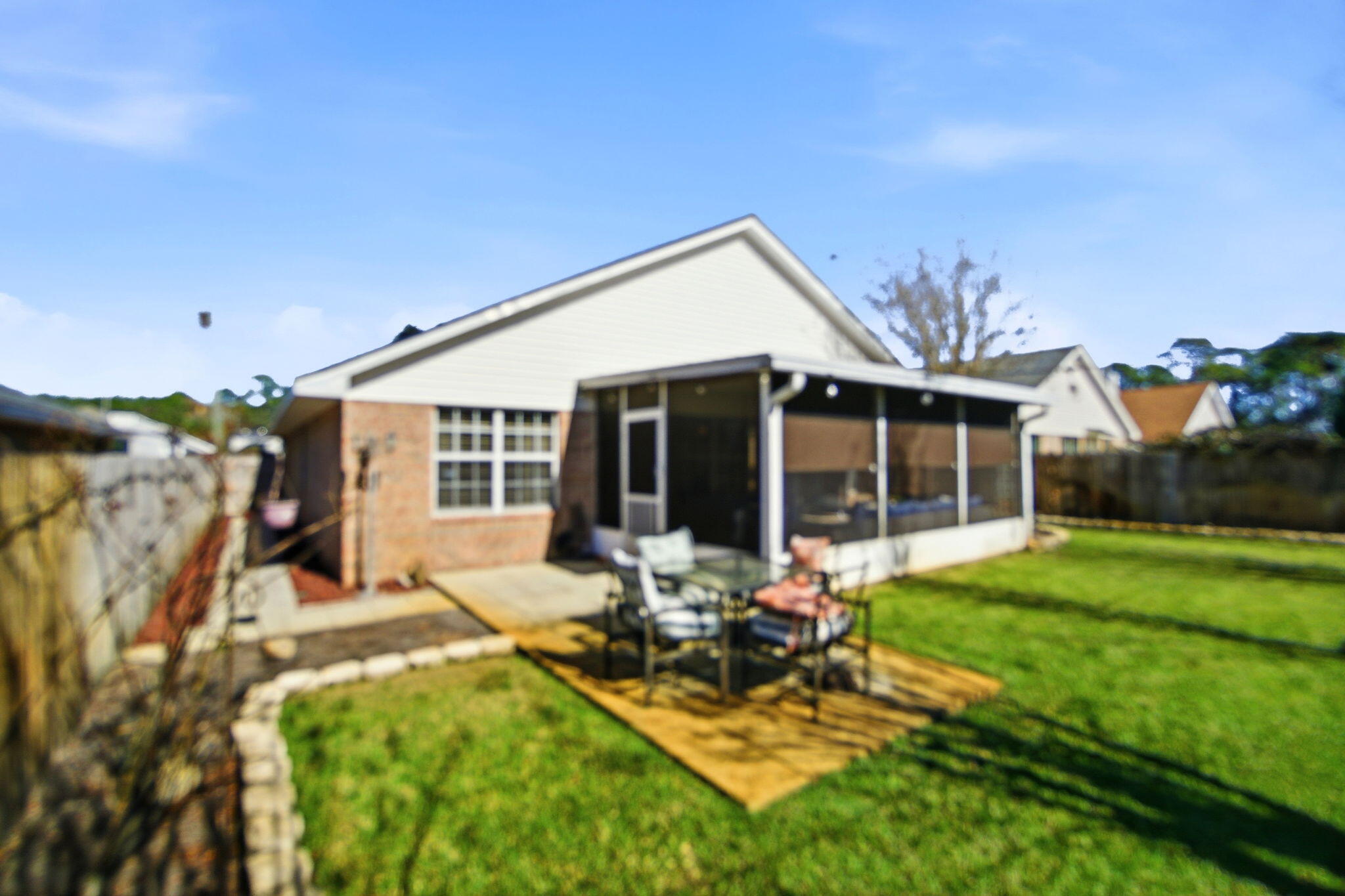 570 Rough Leaf Lane Mary Esther, FL 32569 - Photo 52 of 58 a view of a house with backyard porch and sitting area