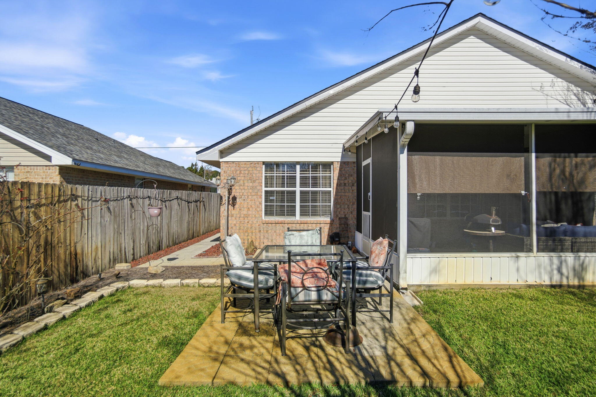 570 Rough Leaf Lane Mary Esther, FL 32569 - Photo 56 of 58 a view of a house with backyard sitting area and garden