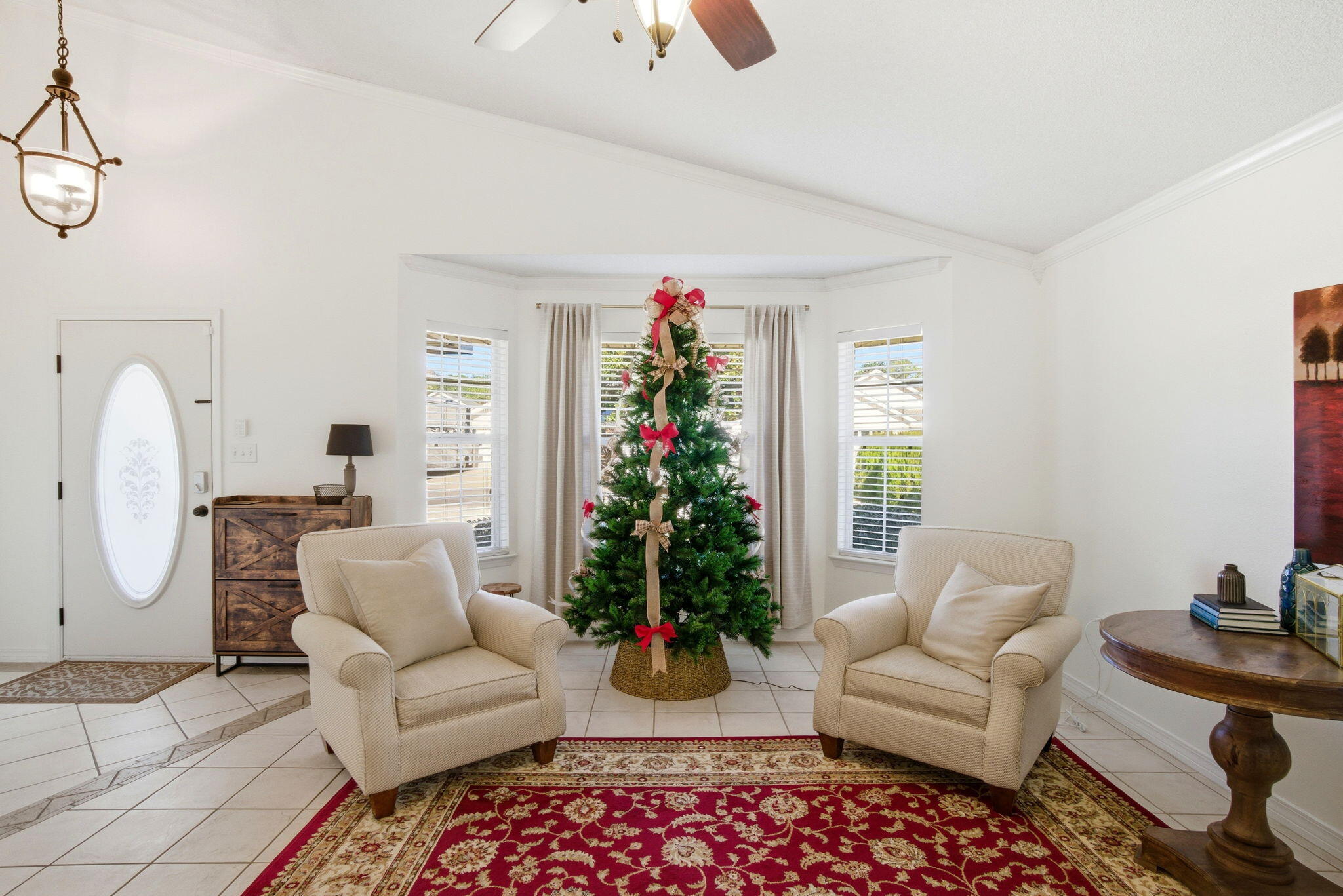 570 Rough Leaf Lane Mary Esther, FL 32569 - Photo 57 of 58 a living room with furniture potted plant and a window
