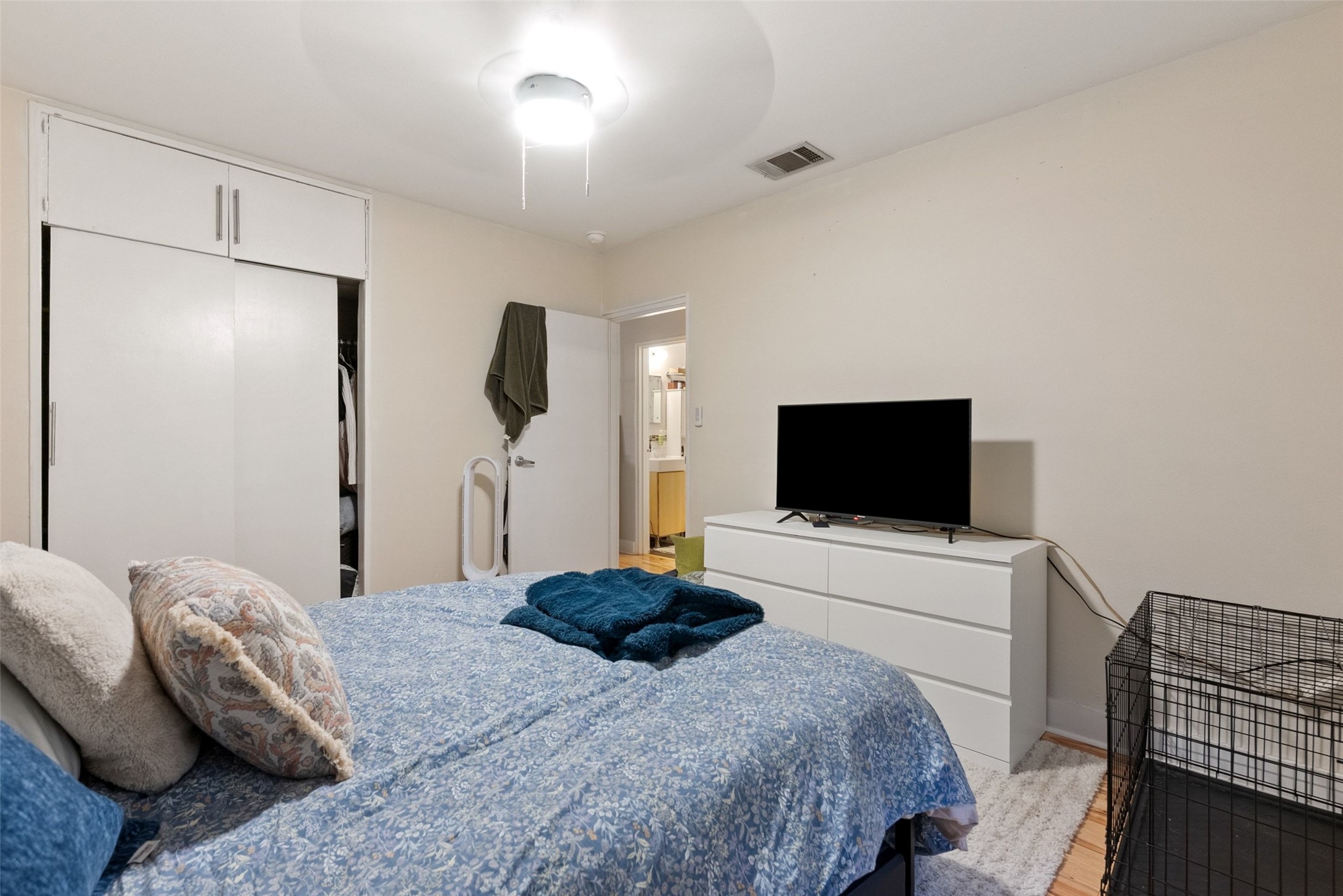 412 West Croslin Street Austin, TX 78752 - Photo 15 of 36 Comfortable sleeping quarters feature convenient built-in storage and direct bathroom access.