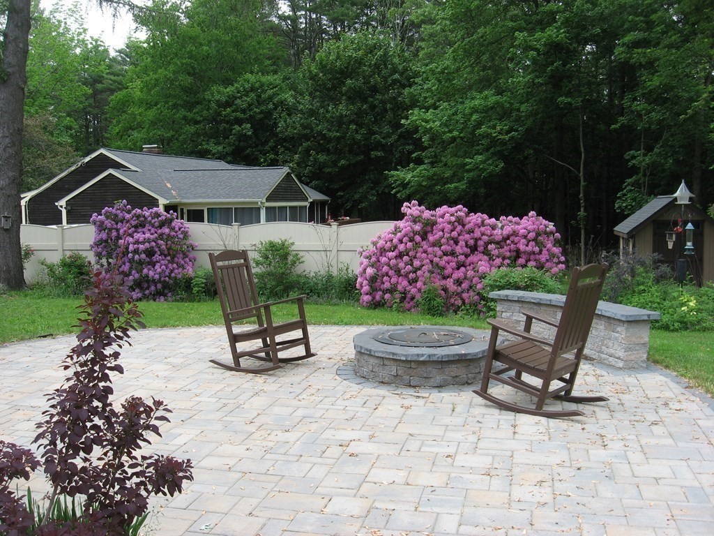 2 Fieldcrest Road Sturbridge, MA 01566 - Photo 12 of 39 a small garden covered with tall trees