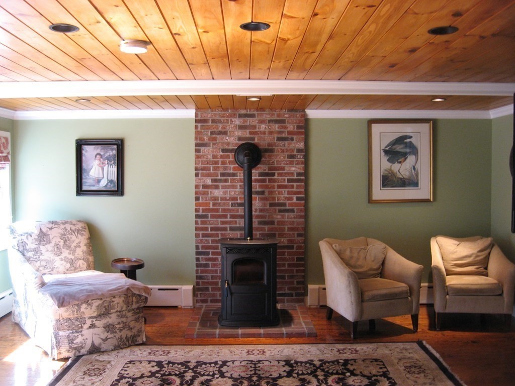 2 Fieldcrest Road Sturbridge, MA 01566 - Photo 19 of 39 a living room with furniture and a fireplace