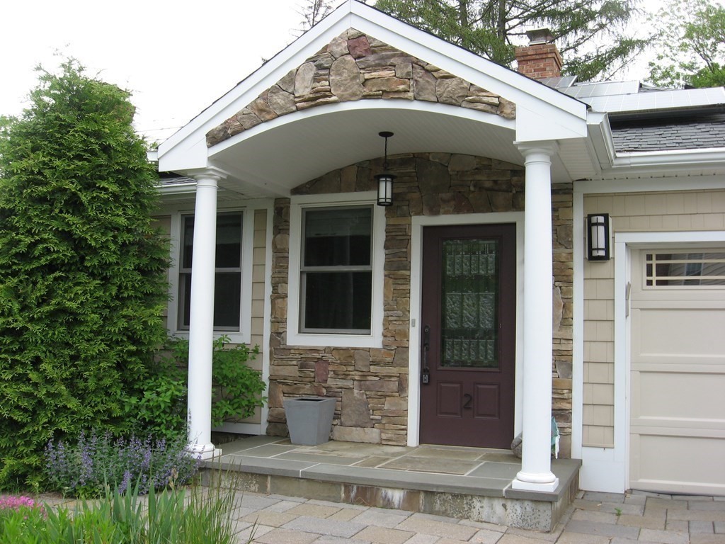 2 Fieldcrest Road Sturbridge, MA 01566 - Photo 2 of 39 a view of a brick house with plants