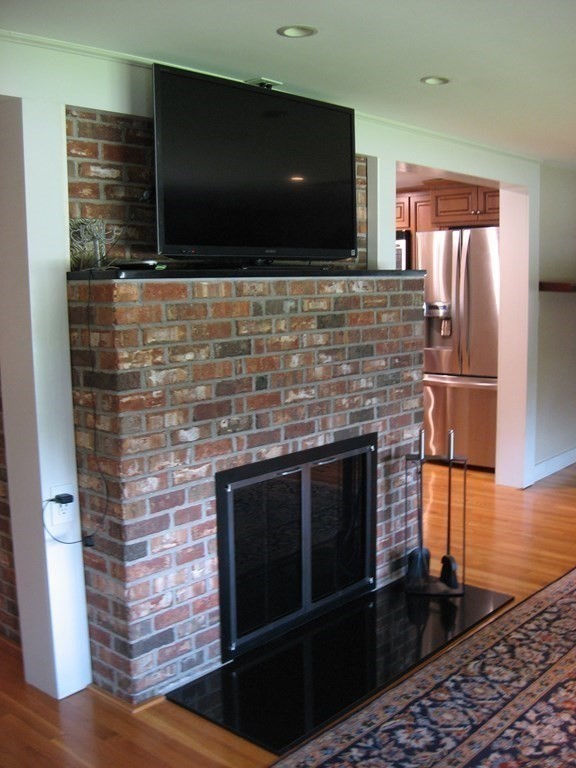 2 Fieldcrest Road Sturbridge, MA 01566 - Photo 23 of 39 a kitchen with granite countertop a stove and a microwave