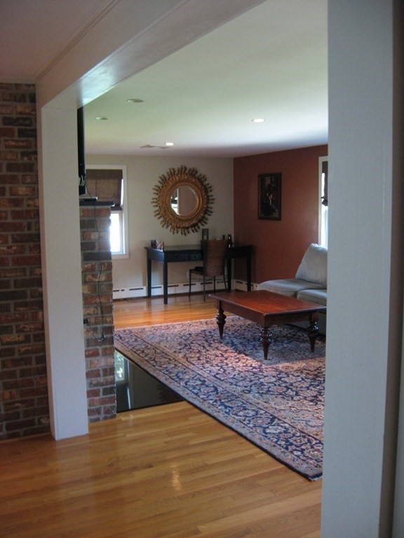 2 Fieldcrest Road Sturbridge, MA 01566 - Photo 25 of 39 a living room with furniture and a mirror