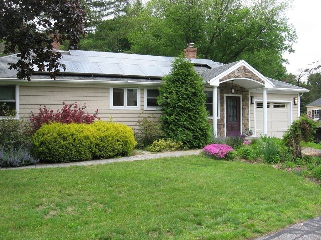 2 Fieldcrest Road Sturbridge, MA 01566 - Photo 3 of 39 a front view of a house with a garden