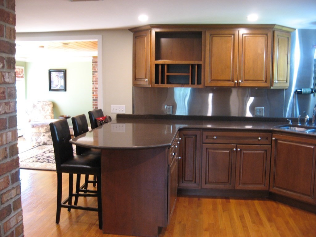 2 Fieldcrest Road Sturbridge, MA 01566 - Photo 35 of 39 a kitchen with a sink cabinets and dining table