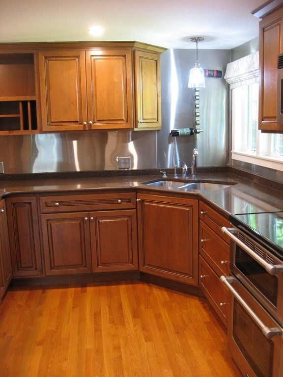 2 Fieldcrest Road Sturbridge, MA 01566 - Photo 38 of 39 a kitchen with granite countertop cabinets stainless steel appliances and a sink