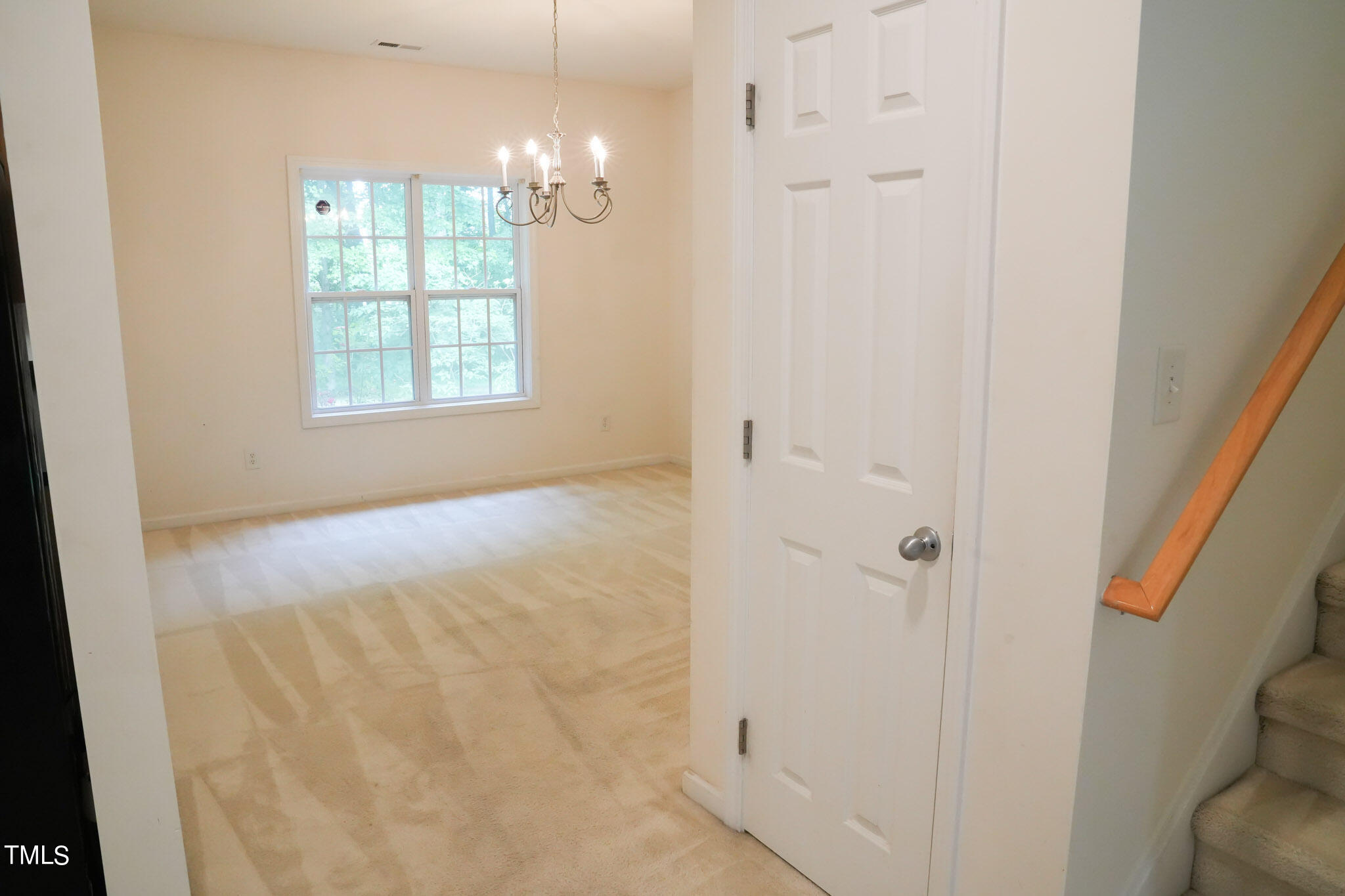 3505 Rendition Street Raleigh, NC 27610 - Photo 8 of 46 an empty room with windows and chandelier