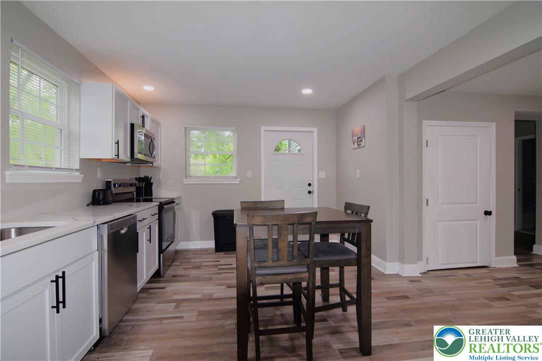 1500 Rock Street, Unit 1 Lehighton, PA 18235 - Photo 26 of 67 a kitchen with stainless steel appliances granite countertop a kitchen island hardwood floor sink and stove