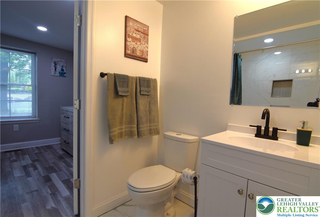 1500 Rock Street, Unit 1 Lehighton, PA 18235 - Photo 33 of 67 a bathroom with a granite countertop toilet sink and mirror