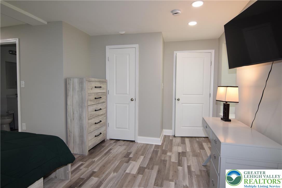1500 Rock Street, Unit 1 Lehighton, PA 18235 - Photo 40 of 67 a view of a bedroom with cabinet mirror and window