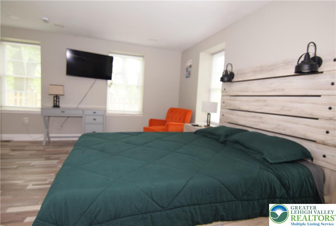 1500 Rock Street, Unit 1 Lehighton, PA 18235 - Photo 42 of 67 a bedroom with a bed and a flat tv screen on the dresser