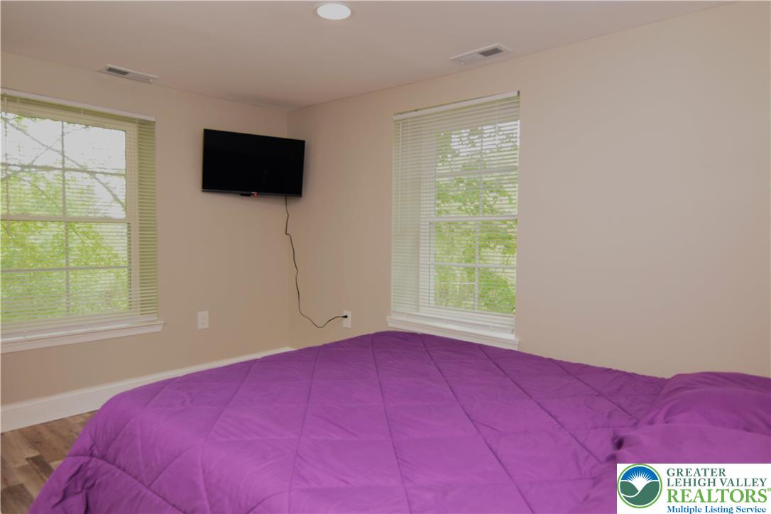 1500 Rock Street, Unit 1 Lehighton, PA 18235 - Photo 45 of 67 a bedroom with a bed and a flat screen tv