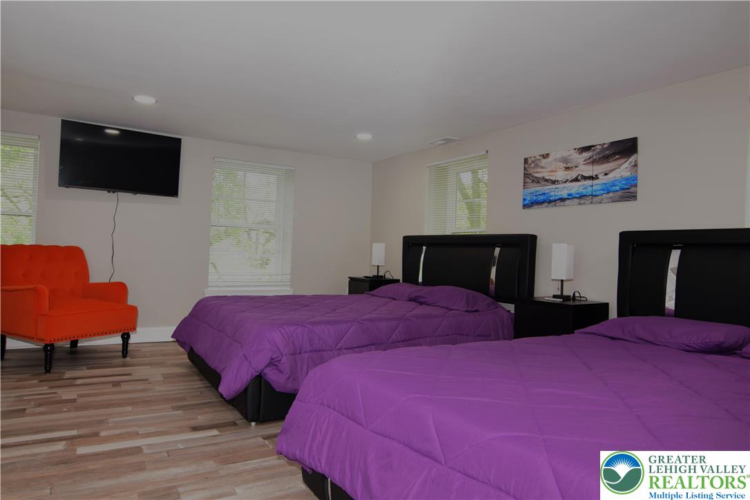 1500 Rock Street, Unit 1 Lehighton, PA 18235 - Photo 53 of 67 a bedroom with a bed and a flat screen tv