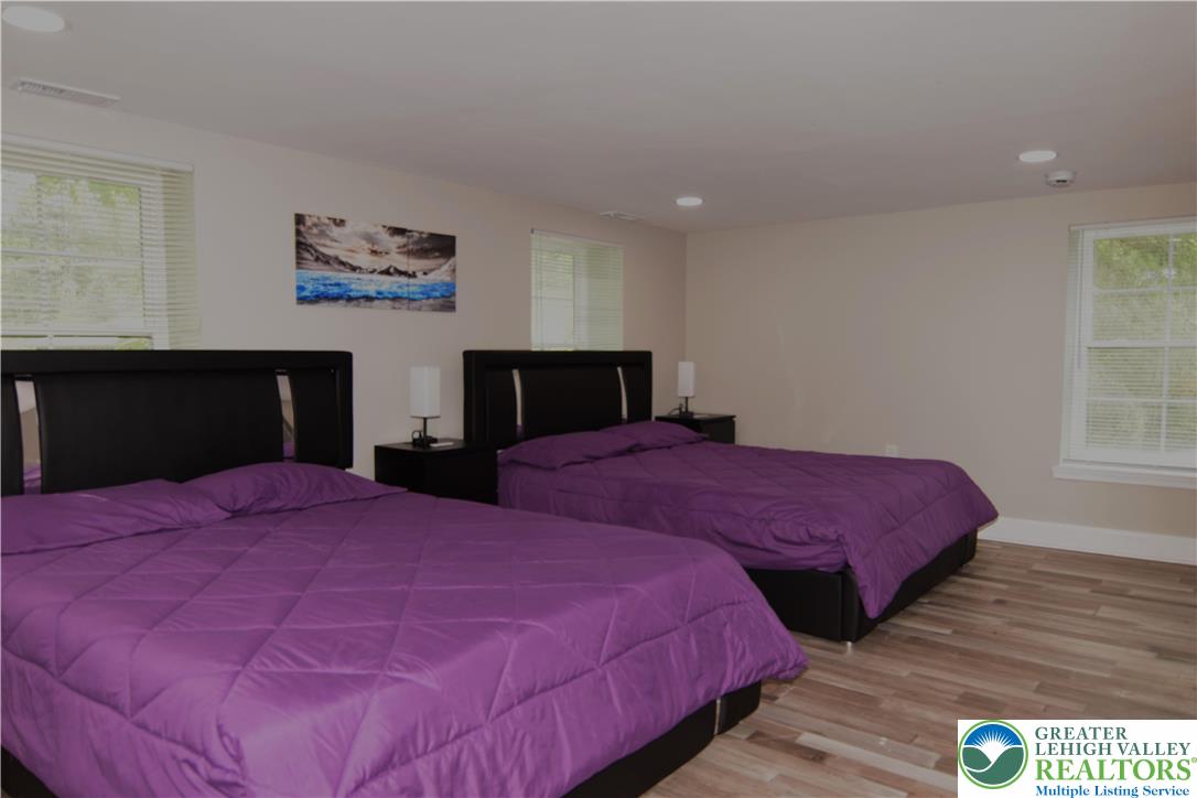 1500 Rock Street, Unit 1 Lehighton, PA 18235 - Photo 55 of 67 a bedroom with a bed and a flat screen tv