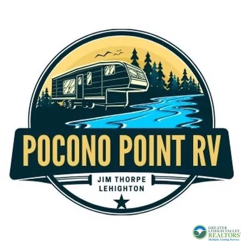 a front view of a house with a tree