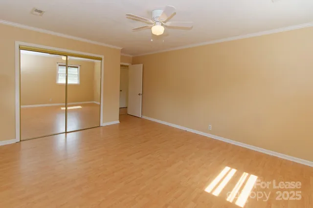 a view of an empty room and window
